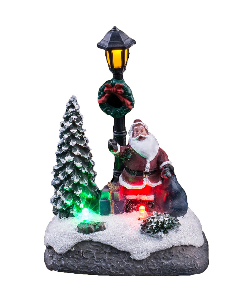 Scena di Natale illuminata con Babbo Natale e regali