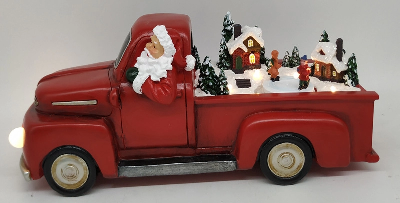 L'auto di Babbo Natale a LED con movimento intorno ai bambini
