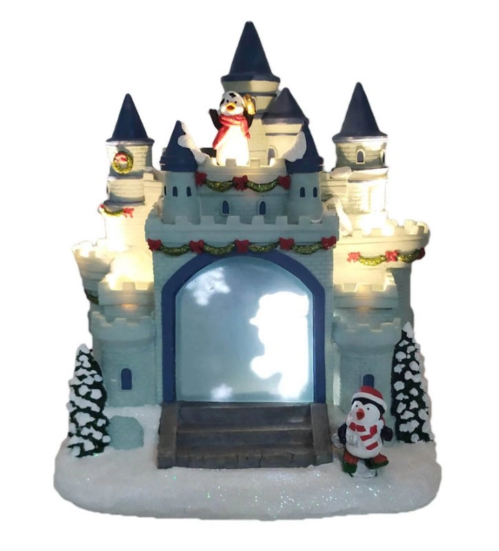 Il castello del pinguino di Natale a LED con il pinguino che corre intorno al castello