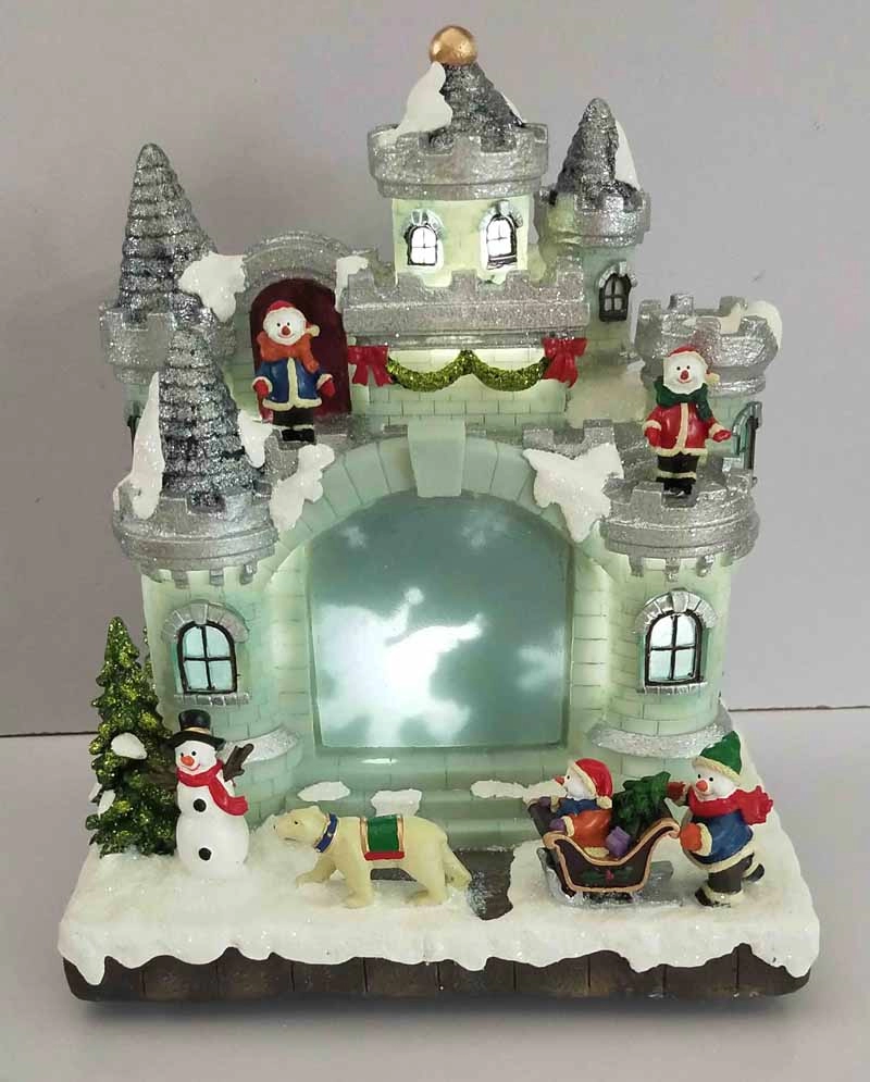 Il castello del pupazzo di neve di Natale a LED con pupazzo di neve che corre intorno al castello