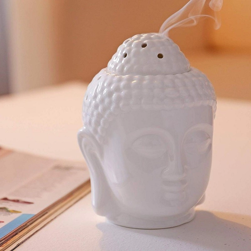Deodorante per ambienti essenziale con bruciatore a olio in ceramica con aroma di testa di Buddha pacifica