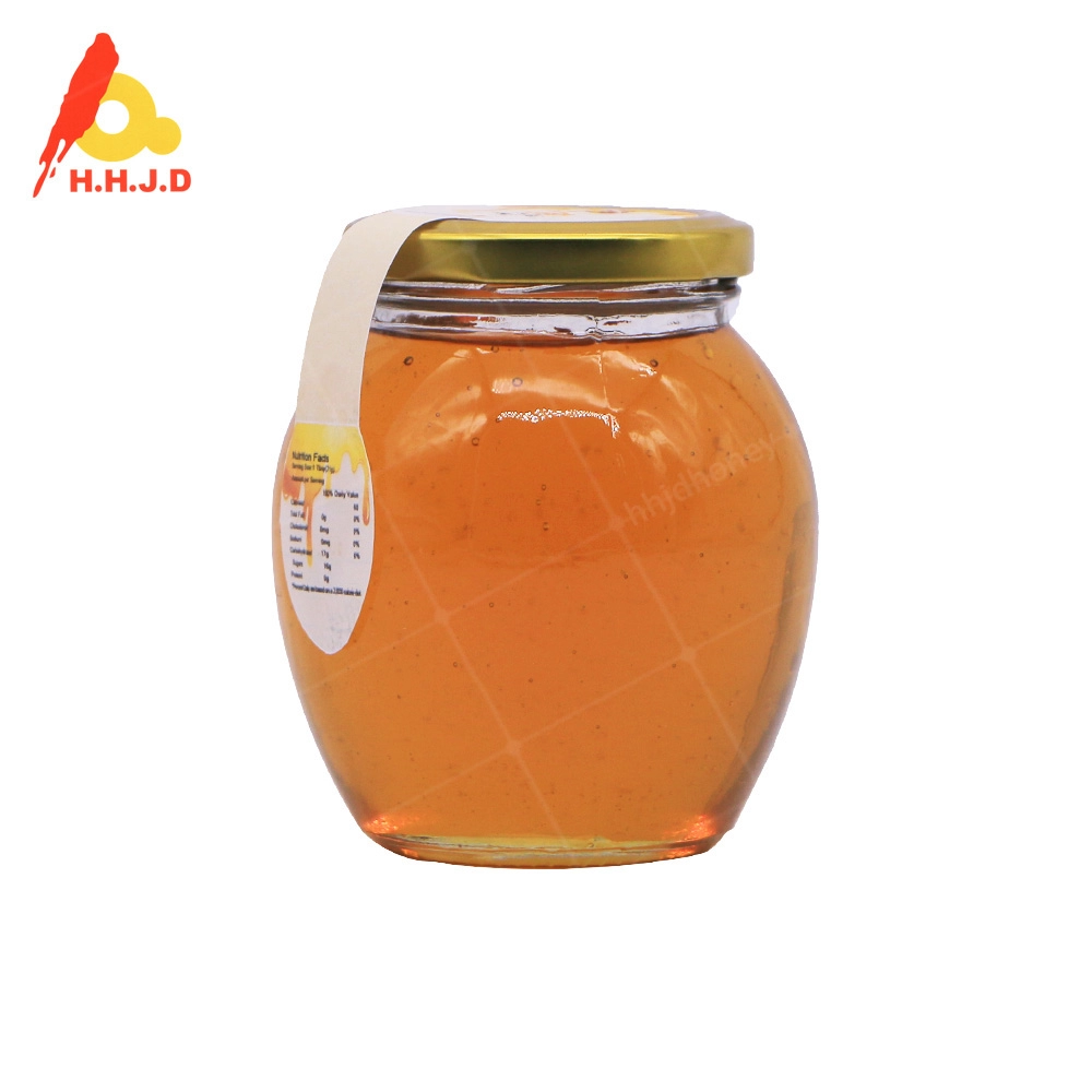 Bottiglia di vendita al dettaglio in fabbrica di miele di girasole crudo naturale