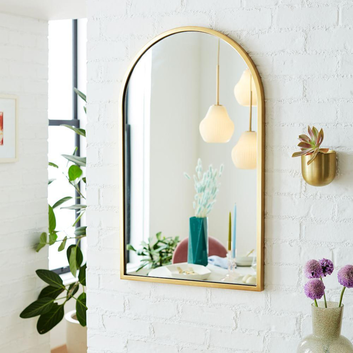 Black round metal wall mirror