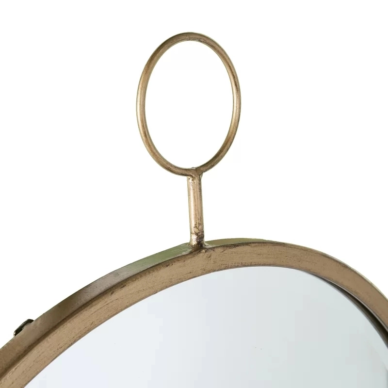 Specchio rotondo moderno con accento dorato