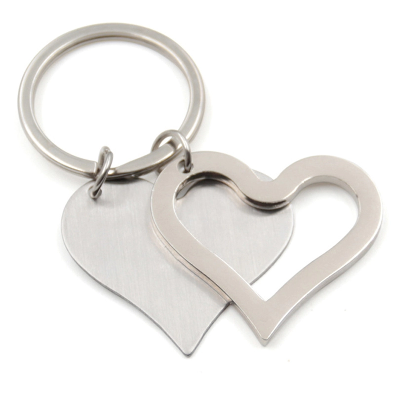 Fabbrica di portachiavi in ​​metallo bianco con coppia a forma di cuore